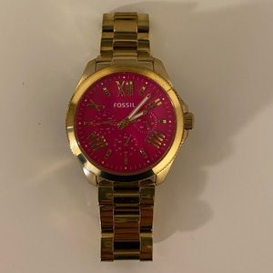 Fossil gold watch.